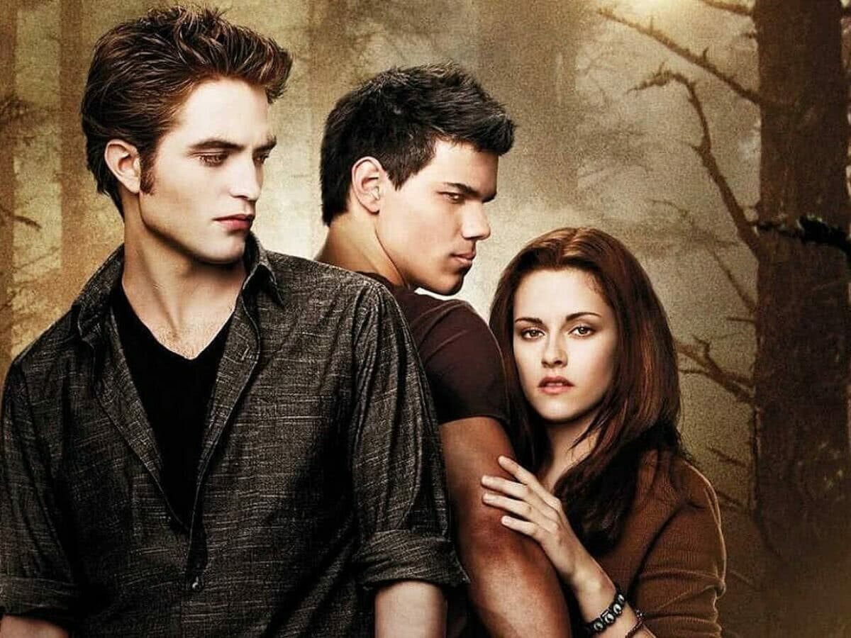 Robert Pattinson, Taylor Lautner e Kristen Stewart em pôster de Crepúsculo.